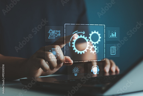 Robotic process automation concept, RPA, artificial intelligence. Man use laptop with virtual automation technology to automate business tasks with AI. Digital transformation and change management.