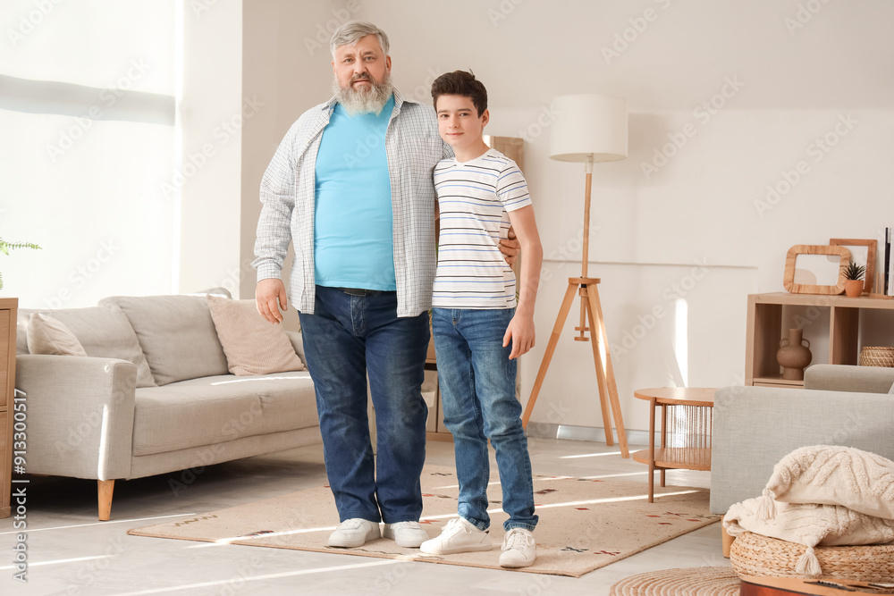 Happy grandfather with his cute grandson at home Happy grandfather with his cute grandson at home