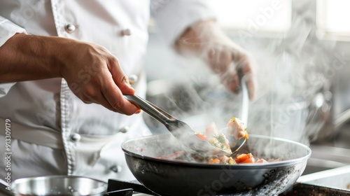 Professional chef cooking in a modern kitchen with smoke rising from a hot pan while stirring delicious food. Close-up of gourmet food preparation showcasing culinary expertise. AI