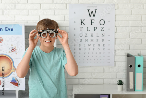 Little boy undergoing eye test in light clinic