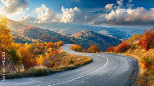 Winding road with autumn colors in the mountain panorama generative ai