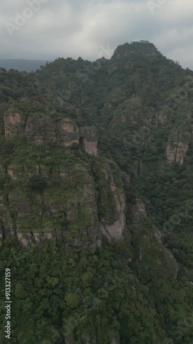 Vertical drone video. Rock formations, forested mountains and large formations. Hiking through the green forest. Hiking concept. Amatlan, Mexico photo