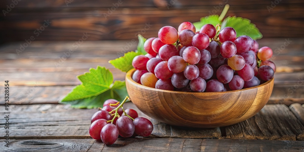 Organic red grapes displayed in a rustic wooden bowl, organic, red grapes, fruit, healthy, natural, fresh Organic red grapes displayed in a rustic wooden bowl, organic, red grapes, fruit, healthy, natural, fresh