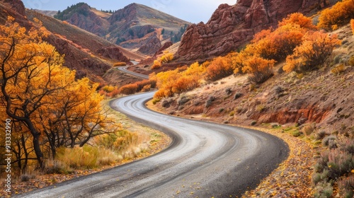 Winding road with bright autumn leaves in the rocky mountains generative ai