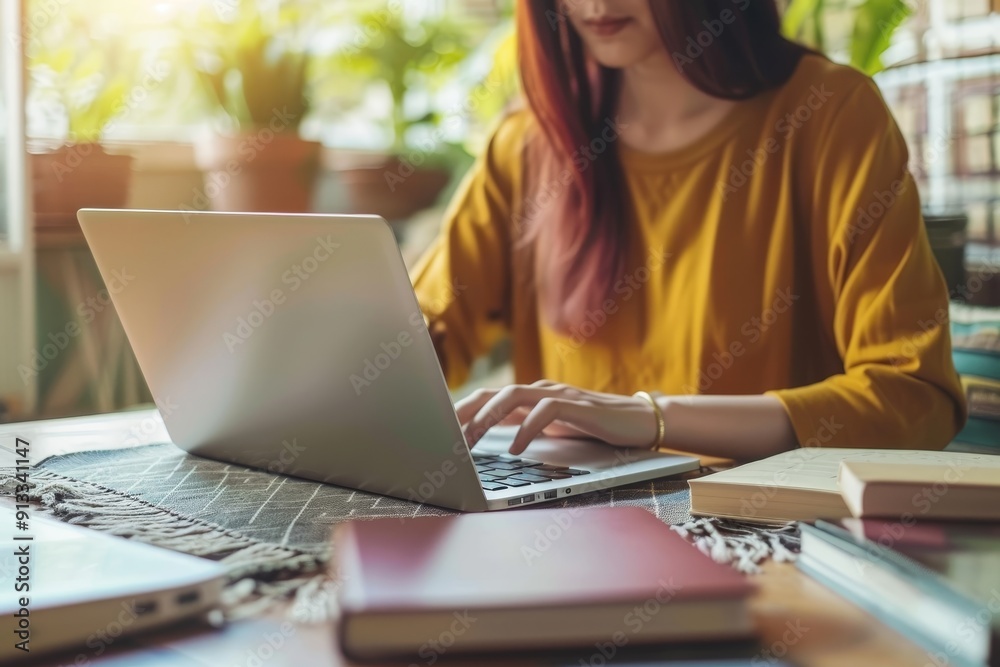 Close-up of freelancer writing content on laptop, showcasing versatility and creativity in freelance work