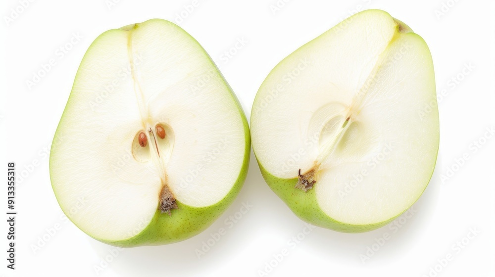 Fresh pears sliced in half, revealing the juicy white flesh and seeds. The vibrant green skin contrasts with the interior on a pure white background Fresh pears sliced in half, revealing the juicy white flesh and seeds. The vibrant green skin contrasts with the interior on a pure white background