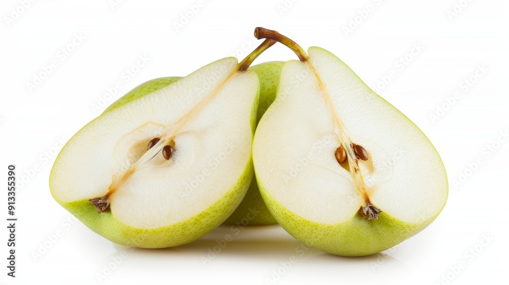 Fresh pears sliced in half, revealing the juicy white flesh and seeds. The vibrant green skin contrasts with the interior on a pure white background Fresh pears sliced in half, revealing the juicy white flesh and seeds. The vibrant green skin contrasts with the interior on a pure white background