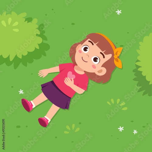 little kid lay down on park and feel happy