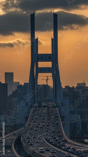 The traffic flow on the Nanpu Bridge and elevated roads in Shanghai at sunset