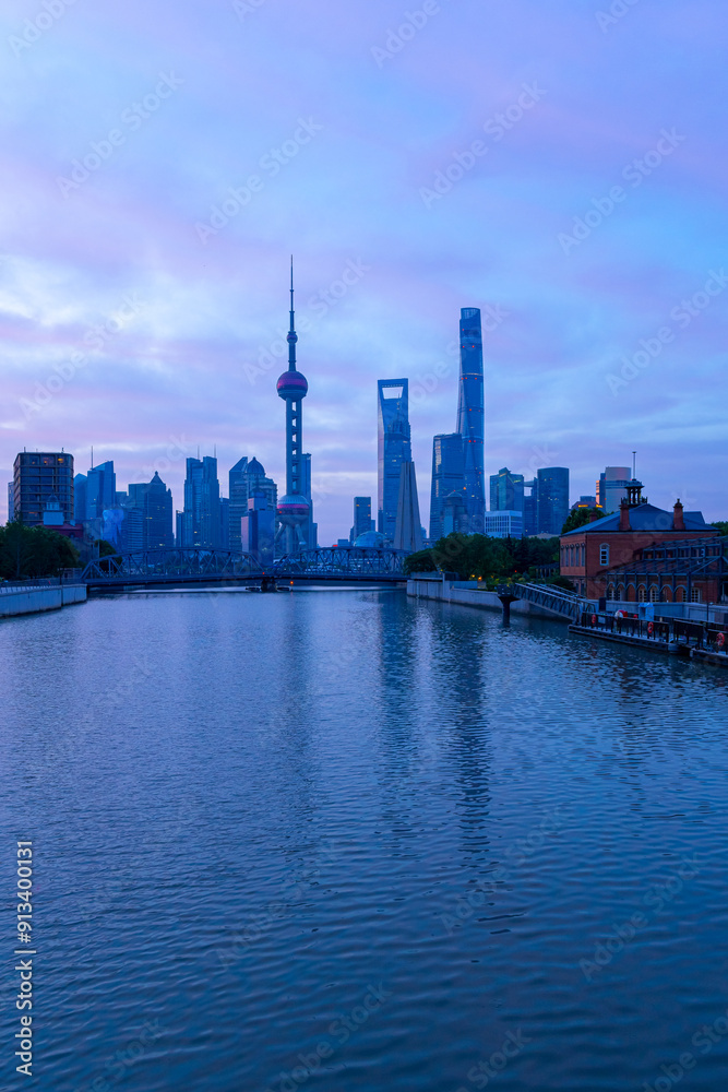 view of modern city skyline and burning clouds at sunrise in Shanghai view of modern city skyline and burning clouds at sunrise in Shanghai