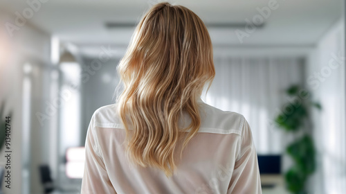 Behind of a professional woman with blonde hair stands in office, Generative AI.