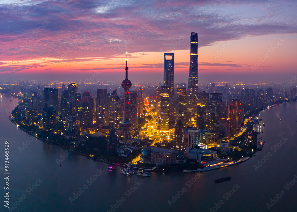 Naklejka premium Aerial view of modern city skyline and buildings at sunrise in Shanghai