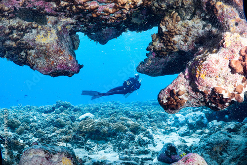A cave and a diver in Manihi, French polynesia, Tuamotu