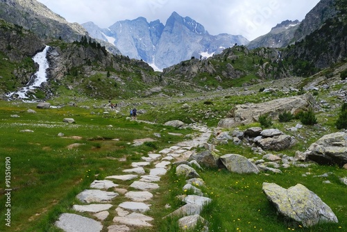 Beautiful scenery of Pyrenees National Park. Tourist trail to  Refuge des Oulettes de Gaube around mountain massif with glacier Oulettes and Vignemale - the highest peak of French Pyrenees. 