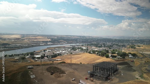 Wide aerial of Lewiston Idaho town with industrial plants along Clearwater River photo