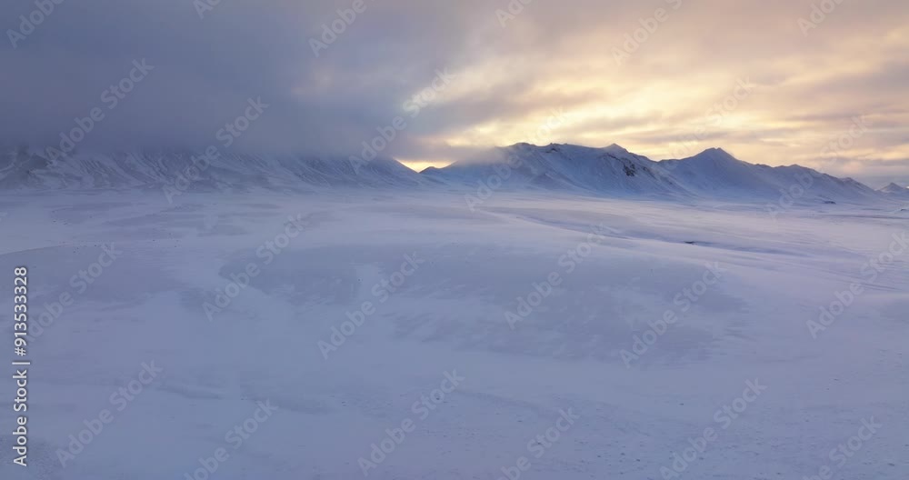 Drone Captures Snow-Covered Mountains At Sunset Drone Captures Snow-Covered Mountains At Sunset
