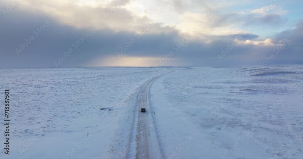 Driving Along Isolated Snowy Road During Daytime Driving Along Isolated Snowy Road During Daytime