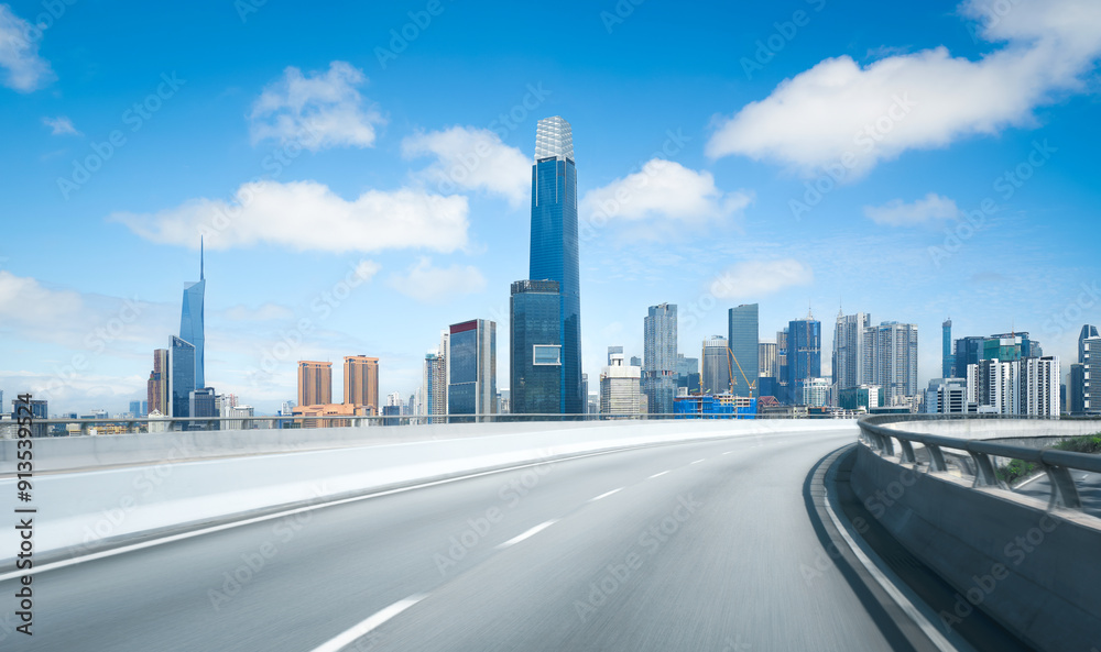 Fototapeta premium Highway overpass motion blur with modern city skyline in Kuala Lumpur