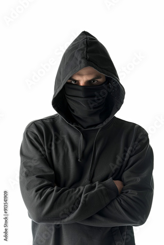 Violence concept with a half-turned thief wearing a black mask and hoodie, looking angrily at the camera, isolated on a white background photo