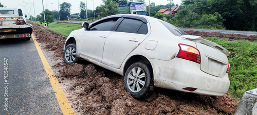 Φωτογραφία white veichle, accident on the road in Thailand with mud stuck to its side near