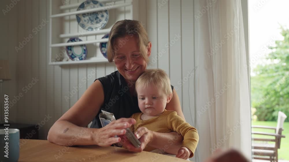 Woman Shuffling Cards With Infant In Lap Woman Shuffling Cards With Infant In Lap