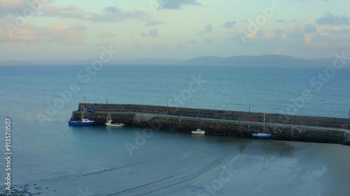 Aerial timelapse of Spiddal Pier, Galway Bay. Establishing shot. photo