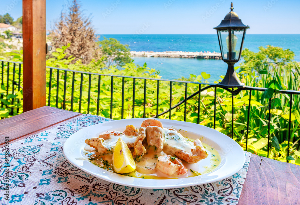 Baked fish in sauce. Nessebar. Bulgaria