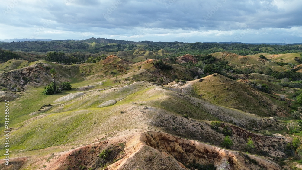 Fototapeta premium Aerial view, natural panorama of the savanna hills which are also known as Pajjongan hills in Bombana, Southeast Sulawesi