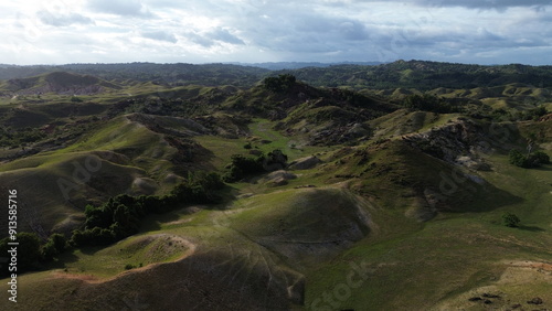 Aerial view, natural panorama of the savanna hills which are also known as Pajjongan hills in Bombana, Southeast Sulawesi photo