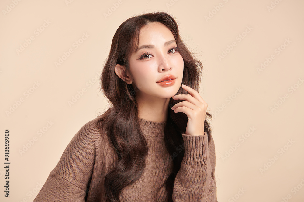 Fototapeta premium Beautiful young asian woman with clean fresh skin on beige background, Face care, Facial treatment, Cosmetology, beauty and spa, Asian women portrait.
