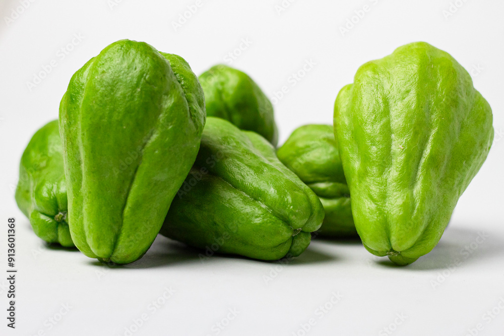 Fresh chayote (Sechium edule) isolated with clipping path and on white background, vegetables and fruits Fresh chayote (Sechium edule) isolated with clipping path and on white background, vegetables and fruits