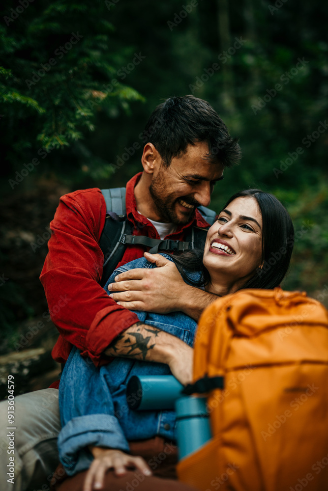 Smiling woman being embraced by her boyfriend from behind. Couple enjoying on vacation. Smiling woman being embraced by her boyfriend from behind. Couple enjoying on vacation.