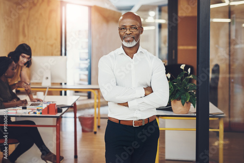 Portrait, arms crossed and mature business man in office for career, pride or leadership. Glasses, confident professional and executive boss, ceo and chief creative officer with startup experience