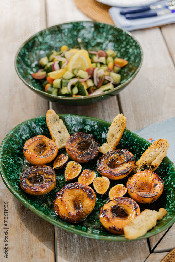 grilled peaches and vegetable salad on set summer table grilled peaches and vegetable salad on set summer table