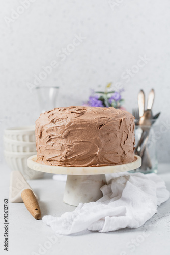 Iced chocolate cake on a cakestand photo