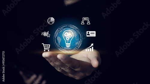 Businessman holding light blub with virtual Global Internet connection. global internet connection application technology and digital marketing, Financial and banking, Digital link tech, big data.