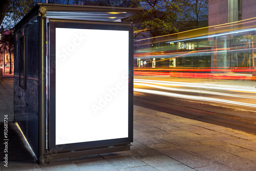 Obraz na plátně Blank White Mock Up Of Vertical Poster Light Box In A Bus Stop At Night