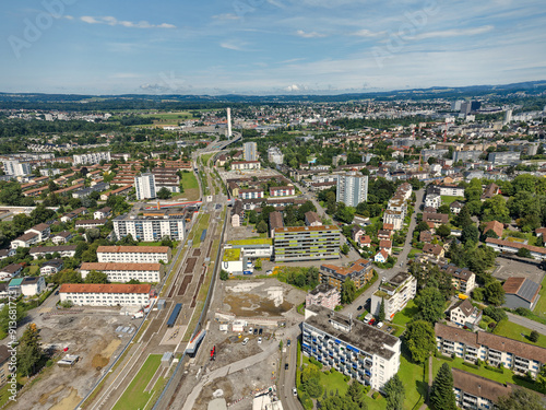 Aerial view over Swiss City of Zürich with highway enclosure and public park on a sunny summer morning. Photo taken August 6th, 2024, Zurich, Switzerland.