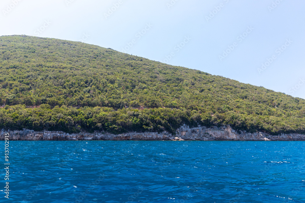 Fototapeta premium The peninsula Karaburun in Albania near the city of Vlore. A touristic hotspots for daytrips to swim in the crystal clear waters and it marks the border between the Adriatic and Ionian seas