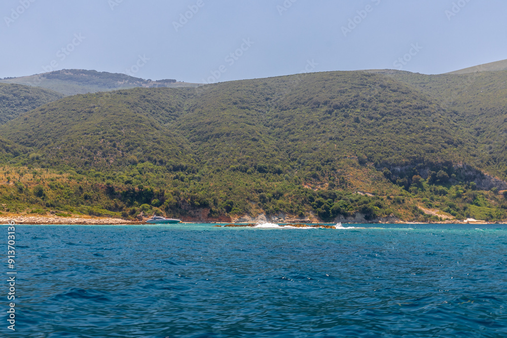 The peninsula Karaburun in Albania near the city of Vlore. A touristic hotspots for daytrips to swim in the crystal clear waters and it marks the border between the Adriatic and Ionian seas The peninsula Karaburun in Albania near the city of Vlore. A touristic hotspots for daytrips to swim in the crystal clear waters and it marks the border between the Adriatic and Ionian seas