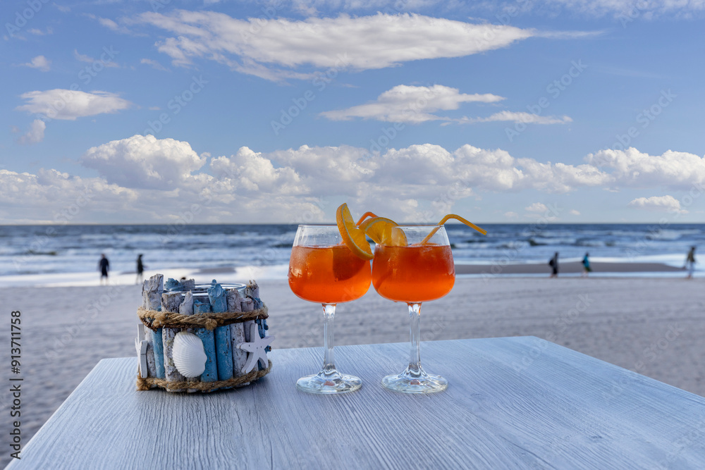 Beach cafe, two aperol drinks on the table, Baltic Sea, Poland