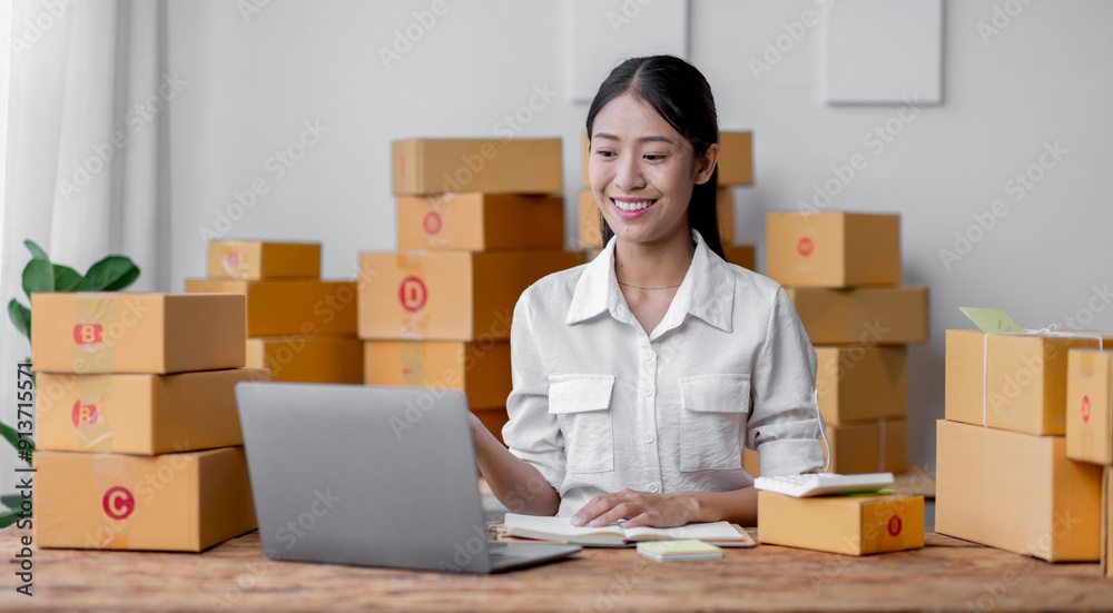 Sme Female ecommerce business owner prepares package box for customer and delivery check balance. asian SME, SME business ideas online. Sme Female ecommerce business owner prepares package box for customer and delivery check balance. asian SME, SME business ideas online.