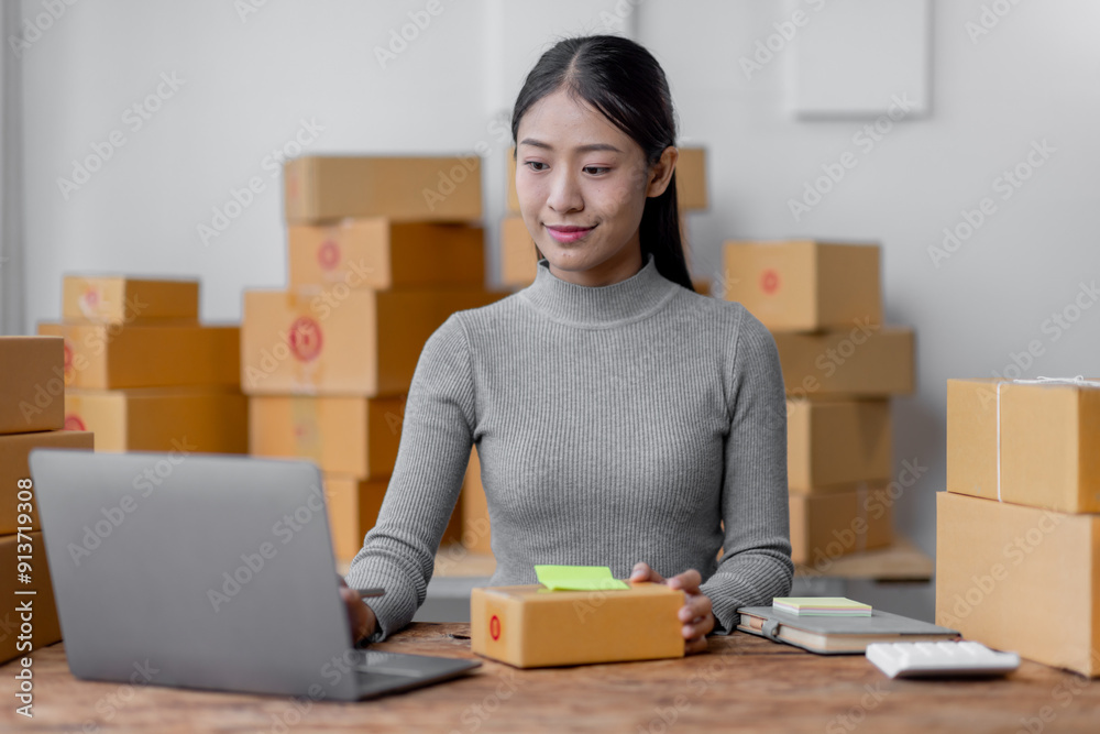 Attractive young freelancer SME owners asian woman entrepreneurs working on receipt box and check online orders, SME home business ideas online. Attractive young freelancer SME owners asian woman entrepreneurs working on receipt box and check online orders, SME home business ideas online.