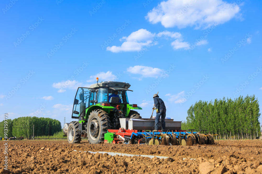 In spring, farmers use farm machinery to grow peanuts In spring, farmers use farm machinery to grow peanuts