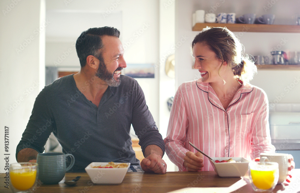 Happy couple, laughing or eating breakfast with cereal, diet or juice in morning meal in home kitchen. People, trust or snack in bowl for bonding, funny joke and food in healthy marriage together Happy couple, laughing or eating breakfast with cereal, diet or juice in morning meal in home kitchen. People, trust or snack in bowl for bonding, funny joke and food in healthy marriage together
