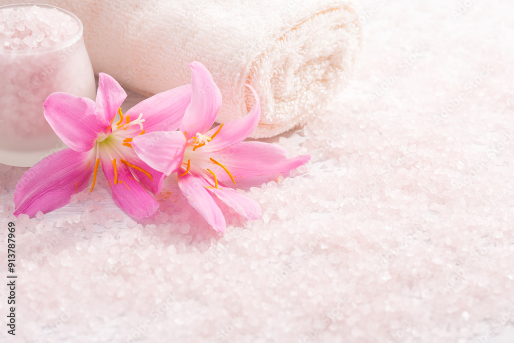 Towel, light pink mineral bath salts and pink Lilies. Spa concept. Towel, light pink mineral bath salts and pink Lilies. Spa concept.