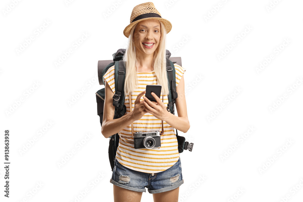 Happy female tourist with a backpack using a mobile phone Happy female tourist with a backpack using a mobile phone