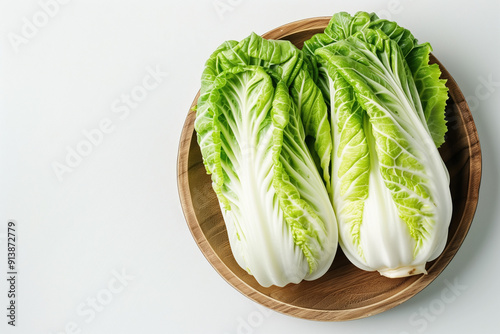 Beautiful Arrangement of Two Chinese Cabbage Heads with Crisp, Green Leaves Against a White Background Ideal for Health and Nutrition photo