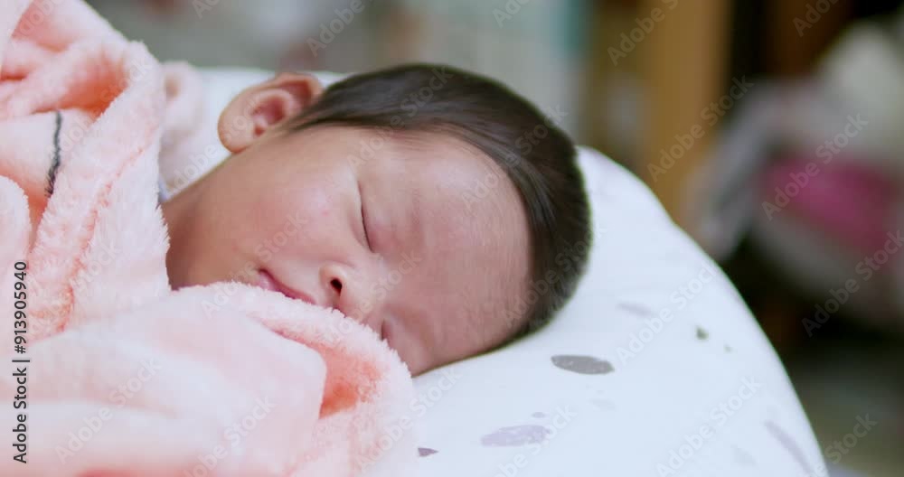 A small newborn baby is cooing and stretching as it looks at things and people that are around in the room. A small newborn baby is cooing and stretching as it looks at things and people that are around in the room.