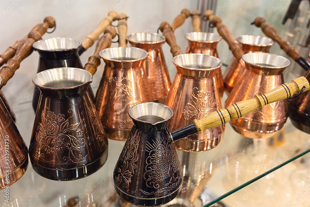 New copper coffee pots on display in a store New copper coffee pots on display in a store
